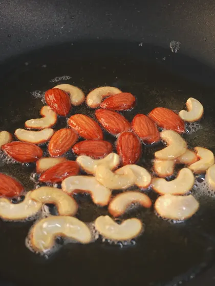 Cashews and almonds roasting in ghee